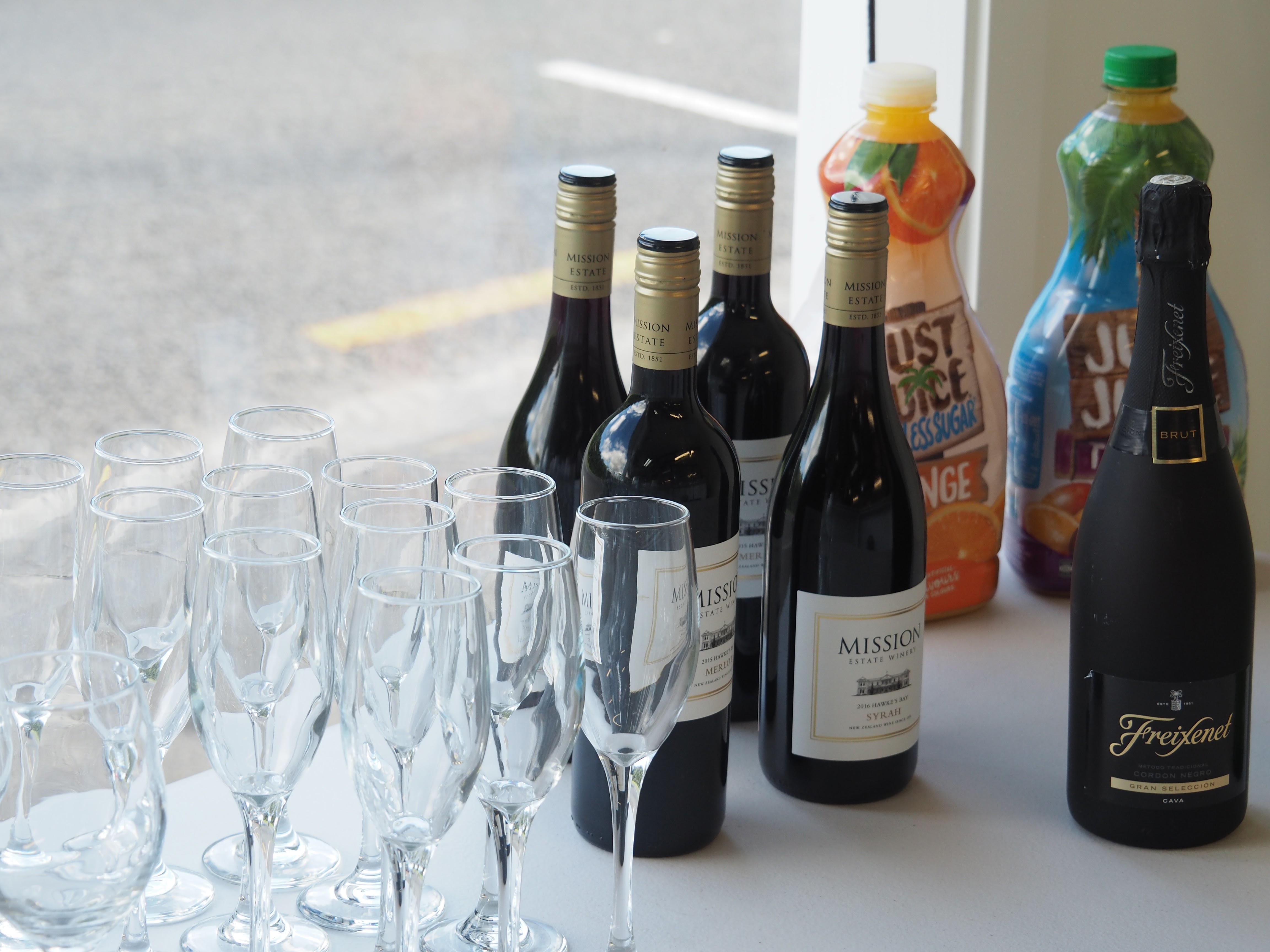 Bar with wine, juice and glasses