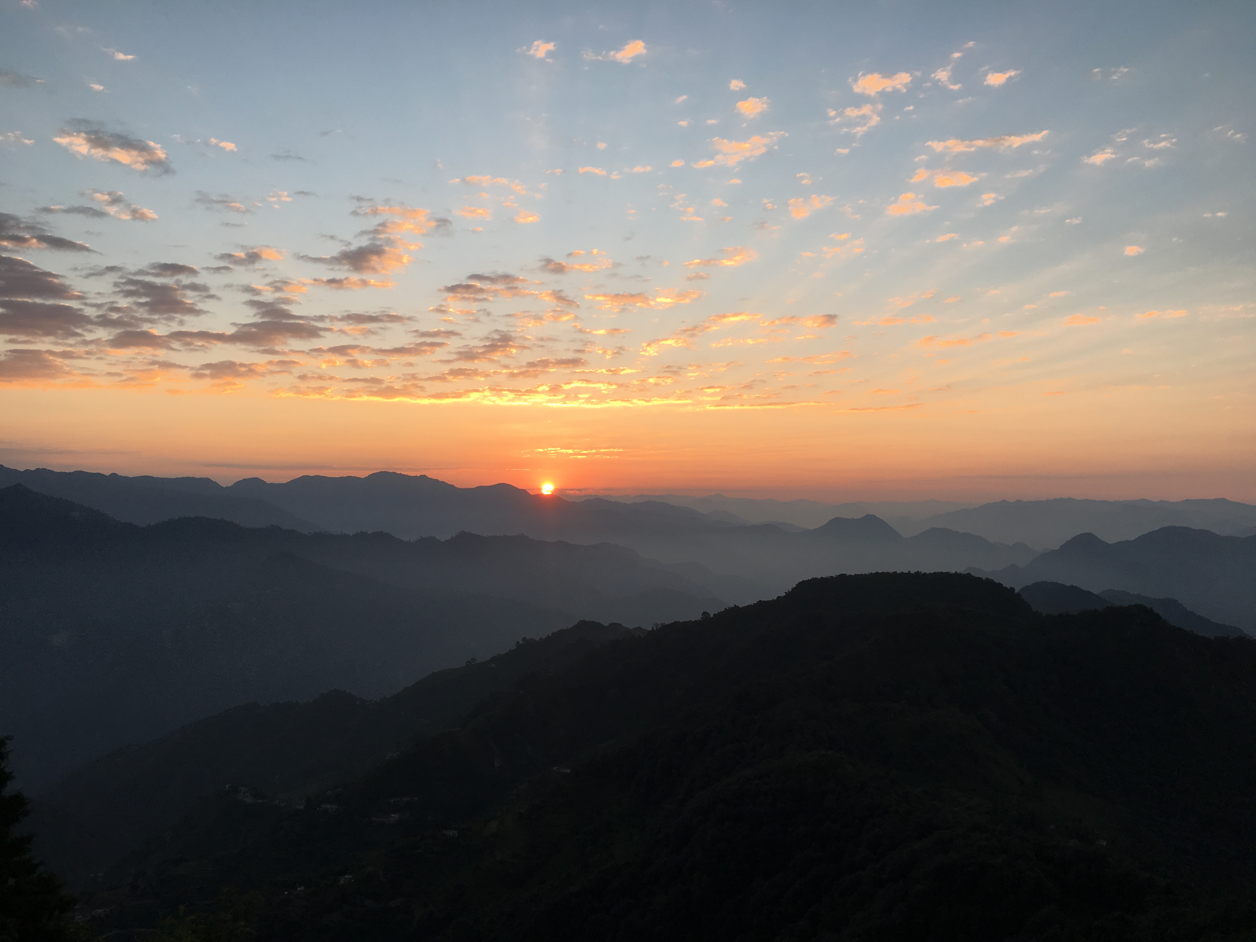 The sun rising over the Himalayas